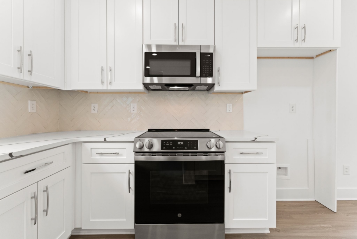 Range and kitchen detail at 1906 Rucker Rd