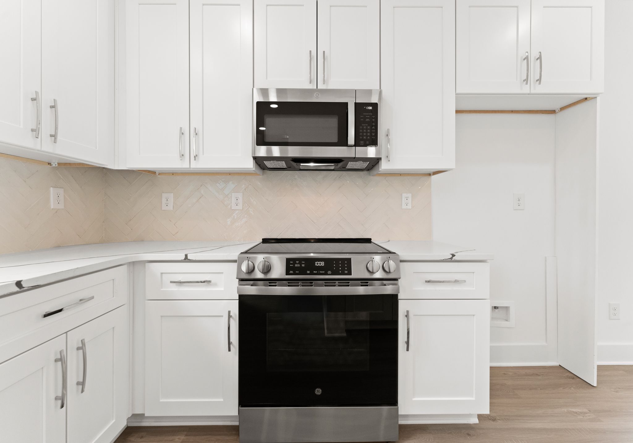 Range and kitchen detail at 1906 Rucker Rd