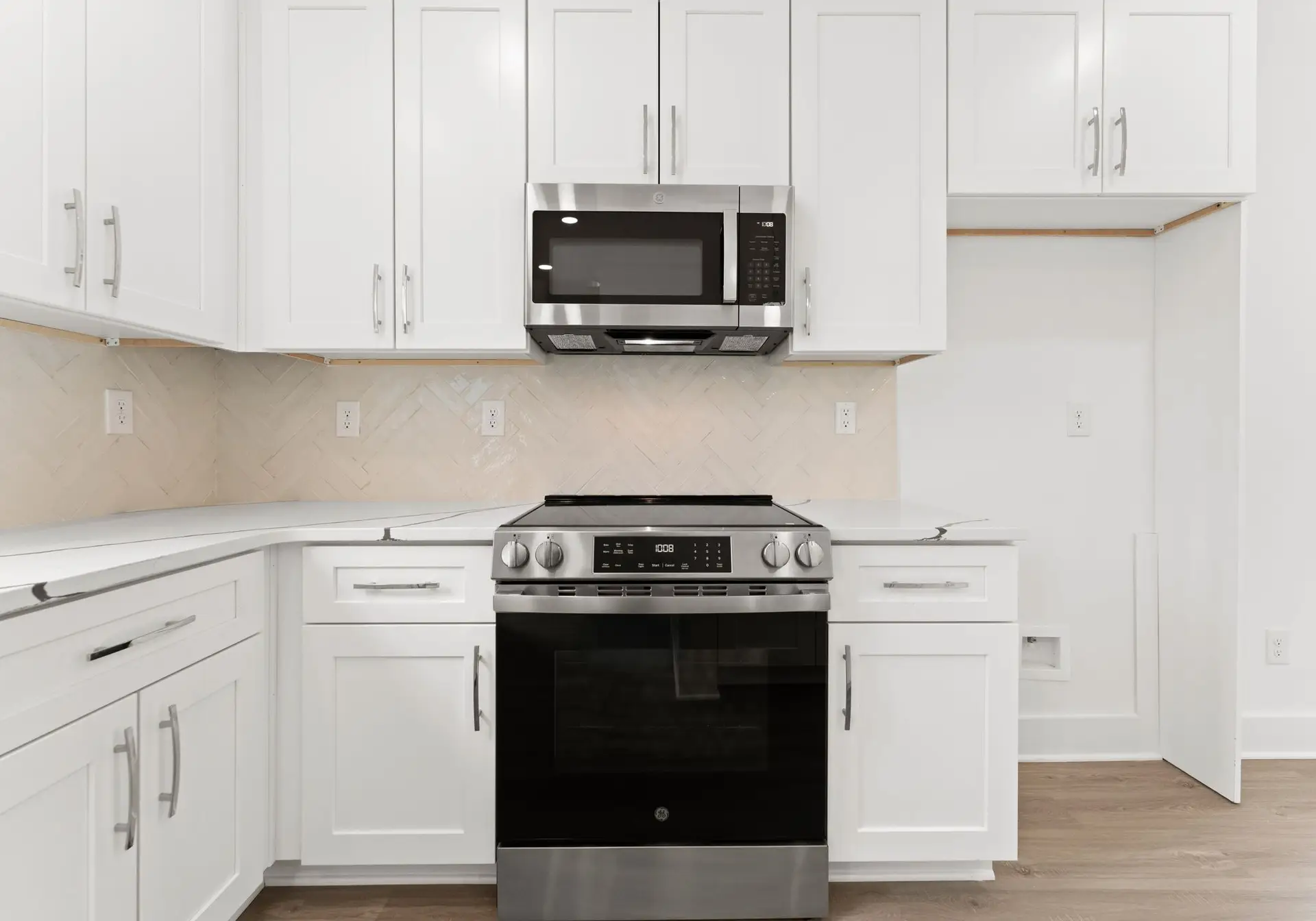 Range and kitchen detail at 1906 Rucker Rd