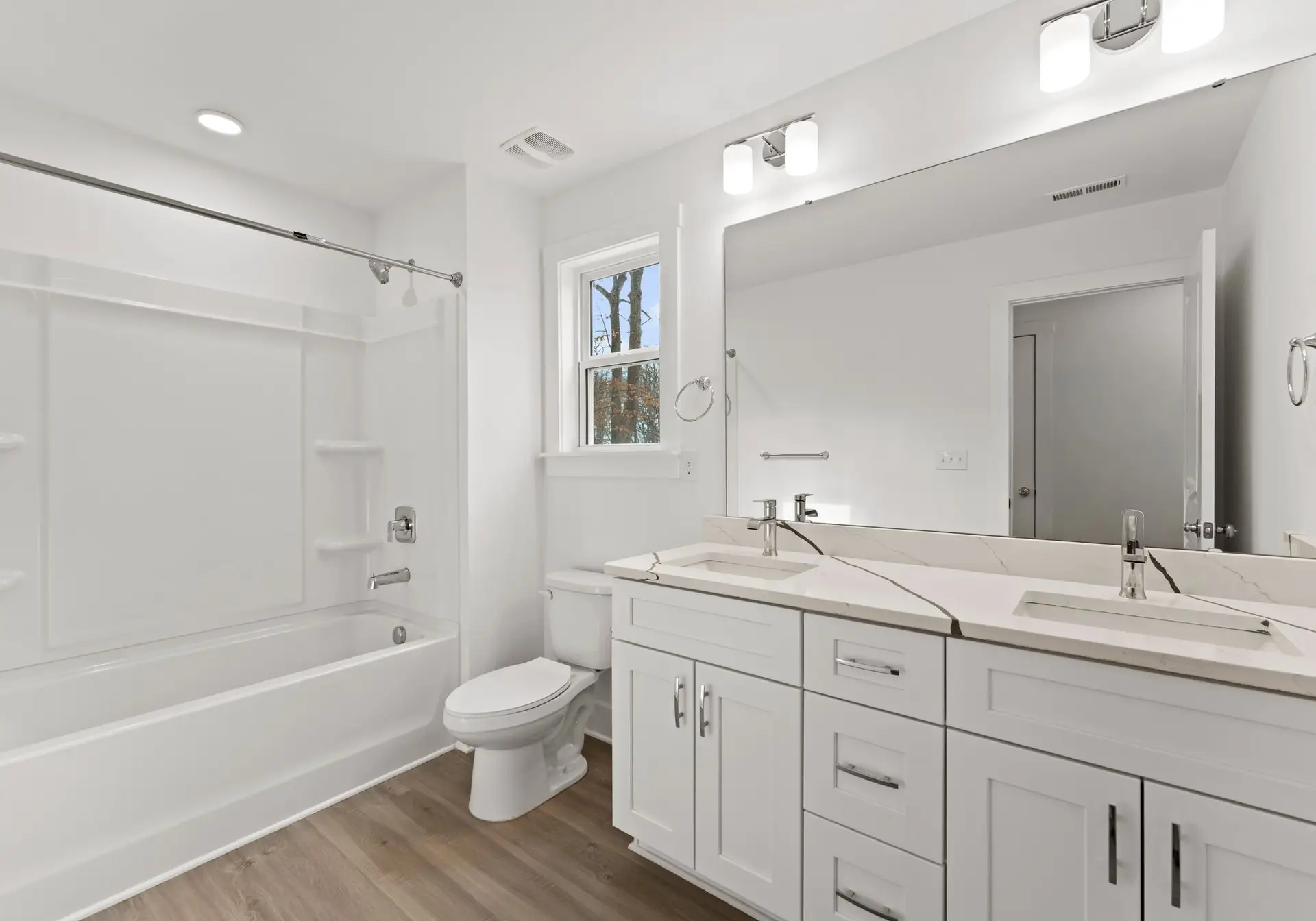 bathroom with tub/shower combo and dual sink vanity at 1906 Rucker Rd