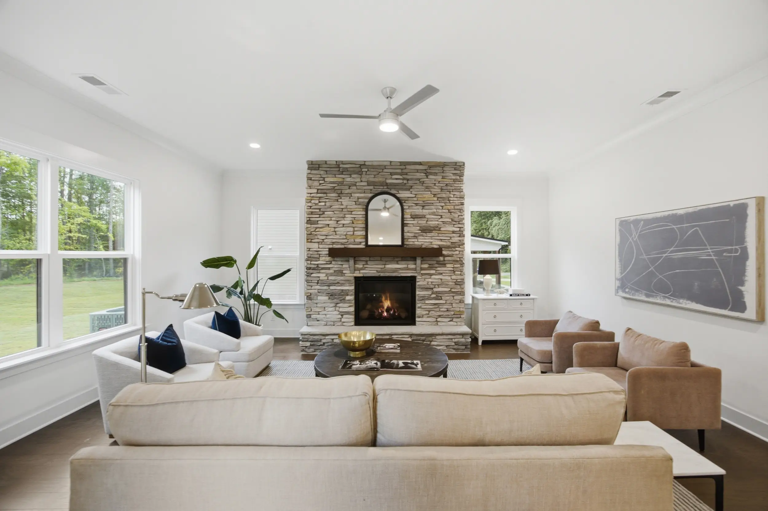 Staged living room with stone fireplace